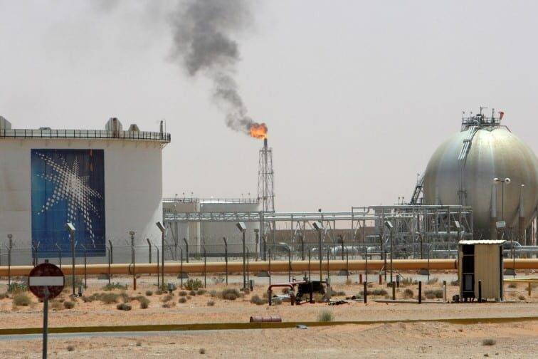 A gas flame is seen in the desert near the Khurais oilfield, about 160 km (99 miles) from Riyadh, Saudi Arabia [REUTERS/Ali Jarekji/File Photo]