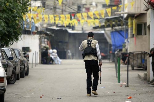 Fatah movement members clash with some Palestinian Islamic groups at Ain al-Hilweh refugee camp in Lebanon's southern port city of Sidon on February 28, 2017 [Mahmoud Al Zain / Anadolu Agency]