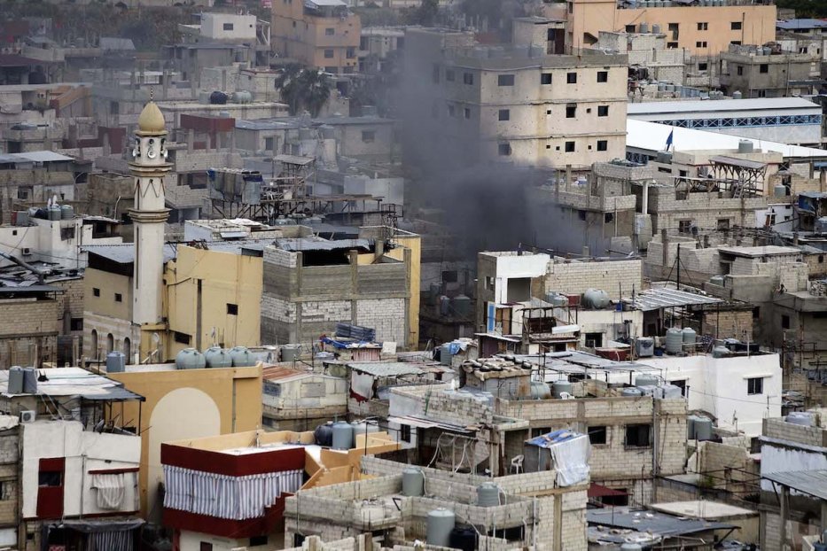 Smoke rises within the clashes between Fatah movement members and some Palestinian Islamic groups at Ain al-Hilweh refugee camp in Lebanon's southern port city of Sidon on 28 February 2017 [Ratib Al Safadi - Anadolu Agency]