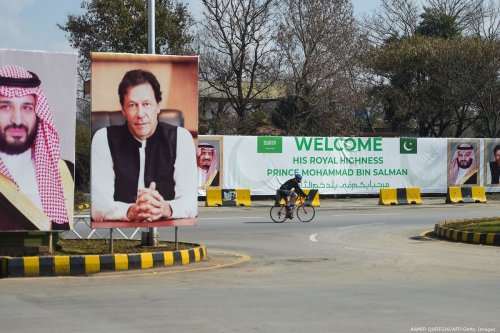 Billboards showing portraits of Saudi Arabia's Crown Prince Mohammed Bin Salman (L) and Pakistan's Prime Minister Imran Khan (R) in Islamabad on 15 February 2019 [AAMIR QURESHI/AFP/Getty Images]