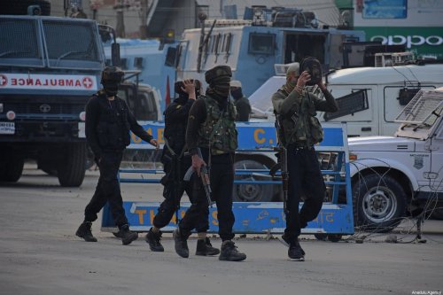 Indian soldiers walk near the site of gun-battle in Pantha Chowk area of Srinagar, Kashmir on August 30, 2020. Three militants and an Assistant Sub Inspector (ASI) of police were killed when encounter broke out between militants and security forces in Pantha Chowk area of Srinagar, police said [Faisal Khan - Anadolu Agency]