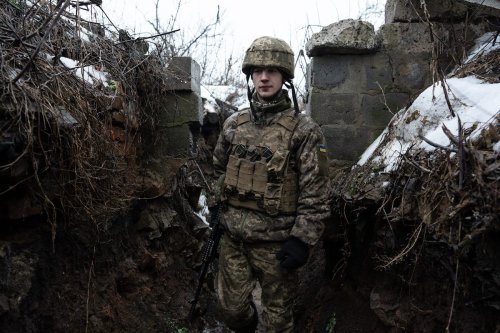 ZOLOTE, UKRAINE - FEBRUARY 03: A Ukrainian soldier keeps guard at a building outside of Zolote, Ukraine on February 03, 2022. ( Wolfgang Schwan - Anadolu Agency )