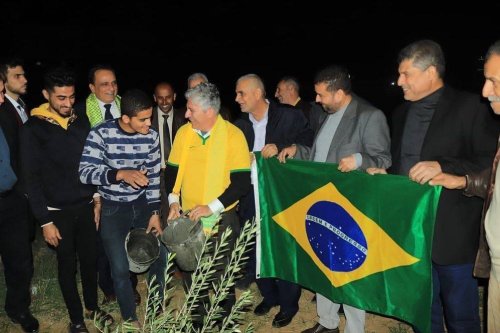The Brazilian Ambassador and Head of the Representative Office of Brazil to the State of Palestine, Francisco Mauro Holland planted olive trees in Rafah, November 2022 [Hassan Eslaih]
