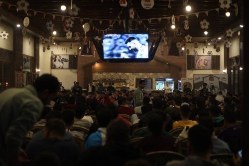 Palestinians watch the World Cup 2022 final which saw Argentina beat France on 18 December 2022. [Mohammed Asad/ Middle East Monitor]