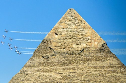 "Silver Stars", the Egyptian Air Force aerobatic team and "Black Eagles", the South Korean aerobatic team perform over the Giza Pyramids in Cairo, Egypt. [Mohamed Abdel Hamid - Anadolu Agency]