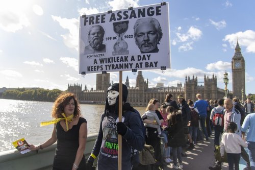 Protesters take part in a demonstration along the River Thames and outside The Houses of Parliament in support of journalist Julian Assange who is facing extradition to the US where he could face 175 years in jail in London, United Kingdom on October 08, 2022 [Ray Tang - Anadolu Agency]