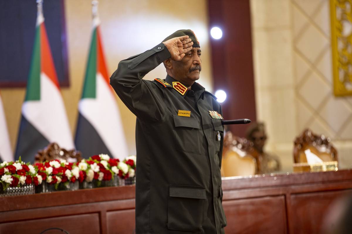 Head of Sudan’s ruling Sovereign Council and Commander-In-Chief of the Sudanese Armed Forces Abdel Fattah al-Burhan salutes during the ceremony held at the Friendship Congress and Meeting Hall in Khartoum, Sudan on December 05, 2022. [Mahmoud Hjaj - Anadolu Agency]