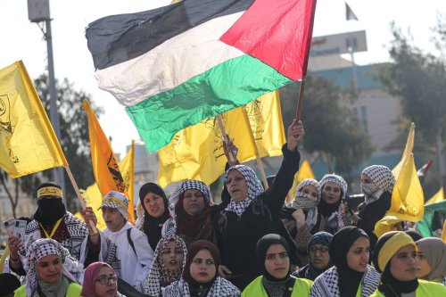 Palestinians attend a rally marking the 58th anniversary of the Fatah Movement Foundation at the al-Kitabeh Square in Gaza City, on December 31, 2022. [Mustafa Hassona - Anadolu Agency]