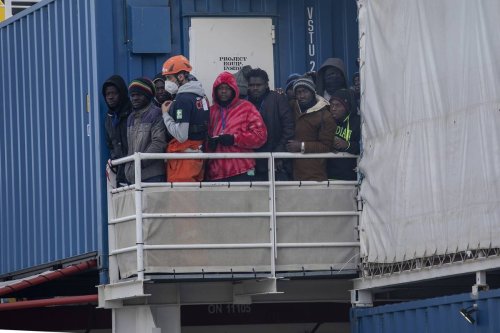 Migrants are seen before get off the Sea-eye4 ship of the German NGO Sea-eye in the port of Naples, Southern Italy on February, 6 2023 [Stringer - Anadolu Agency]