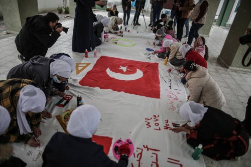 orphan children show solidarity with quake victims from Turkiye and Syria on February 09, 2023 [Ali Jadallah/Anadolu Agency]