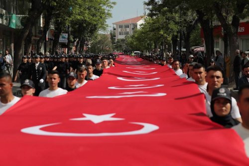 People carry Turkish flag during march held to mark 19th May Commemoration of Ataturk, Youth and Sports Day in Aksaray, Turkiye on May 19, 2022. [Adem Koçak - Anadolu Agency]