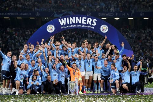 Players of Manchester City pose for a photo with the UEFA Champions League trophy after the team's victory in the UEFA Champions League 2022/23 final match against Inter at Ataturk Olympic Stadium in Istanbul,Turkiye, on June 11, 2023. [Berk Ozkan - Anadolu Agency]