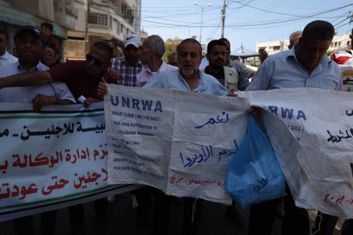 Palestinians hold a demonstration as they demand financial support to the United Nations Relief and Works Agency for Palestine Refugees (UNRWA), in front of the UNRWA building in Gaza Strip, Gaza on June 20, 2023 [Ali Jadallah/Anadolu Agency]