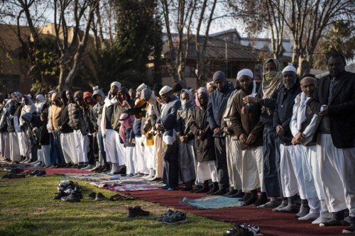 Muslims perform the Eid Al-Adha prayer at a public park in Johannesburg, South Africa on June 28, 2023 [Ihsaan Haffejee/Anadolu Agency]