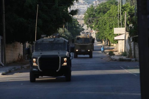 Military vehicles of Israeli forces move streets in Jenin, West Bank on July 03, 2023. [Nedal Eshtayah - Anadolu Agency]