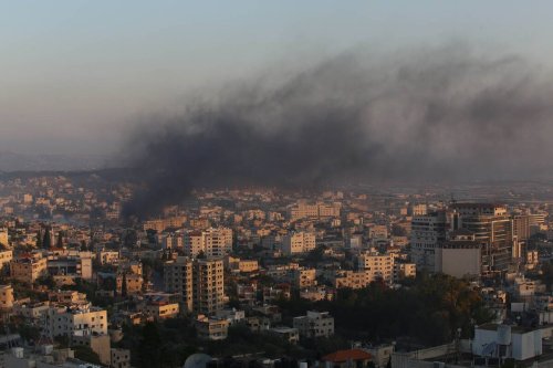 Smoke rises from the buildings after Israeli forces conducted airstrikes and raid on the city of Jenin, West Bank on July 03, 2023 [Nedal Eshtayah - Anadolu Agency]