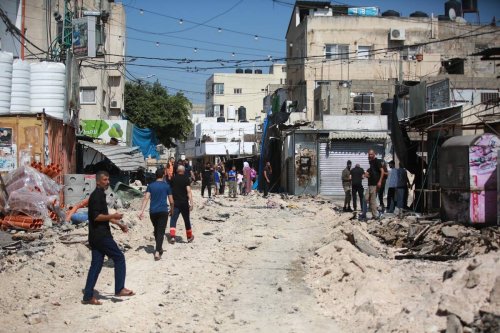 Palestinians walk on the streets after Israeli Forces conducted airstrikes and raid on the city of Jenin, West Bank on July 02, 2023 [Issam Rimawi/Anadolu Agency]