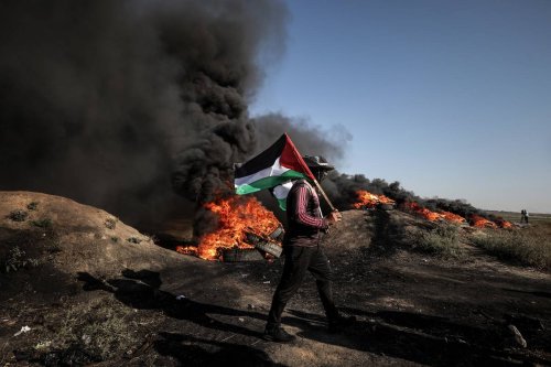 Palestinians burn car tires to protest the violence of Israel in Jenin after at least 9 died and 50 injured, in Gaza City, Gaza on July 03, 2023 [Ali Jadallah - Anadolu Agency]