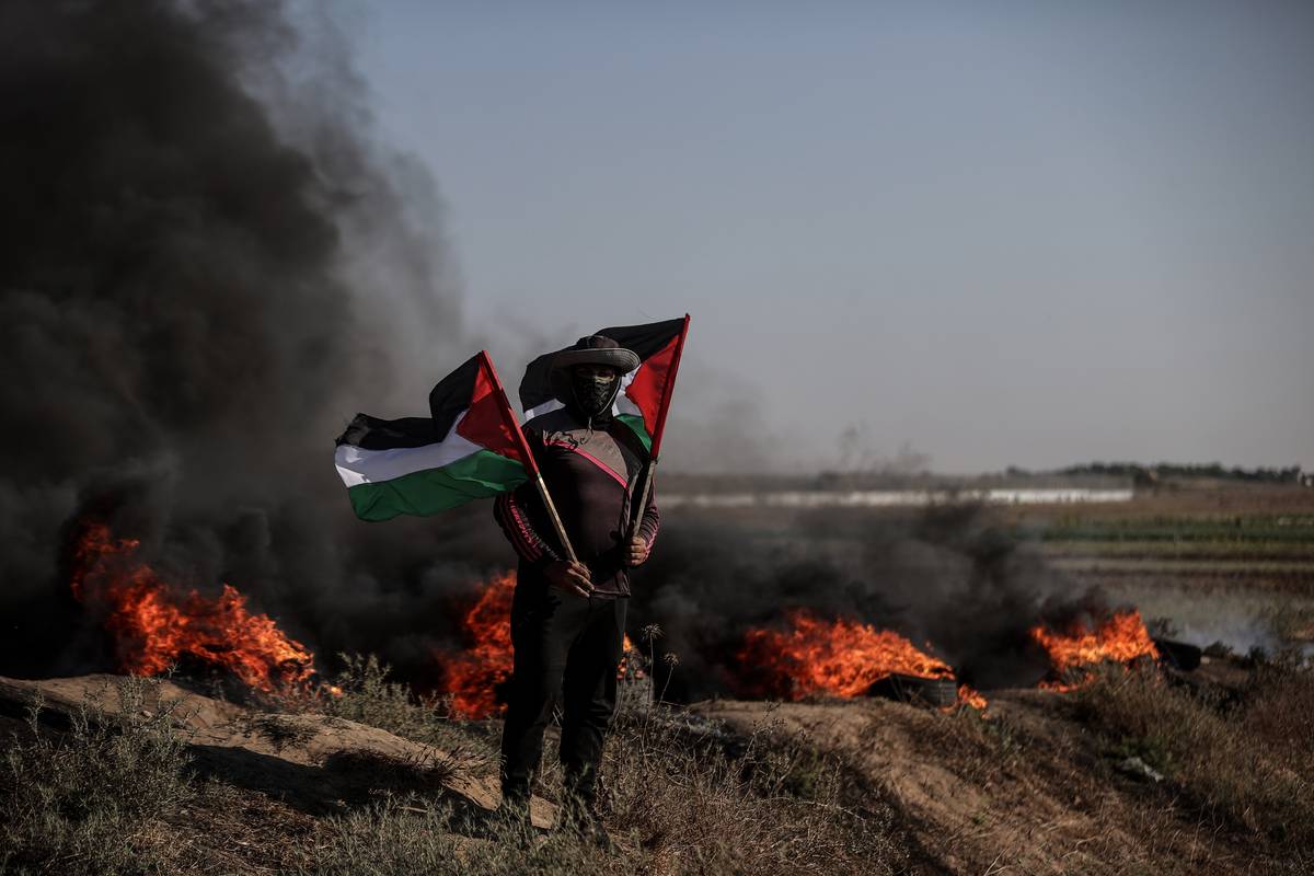 Palestinians burn car tires to protest the violence of Israel in Jenin, on July 03, 2023 [Ali Jadallah/Anadolu Agency]