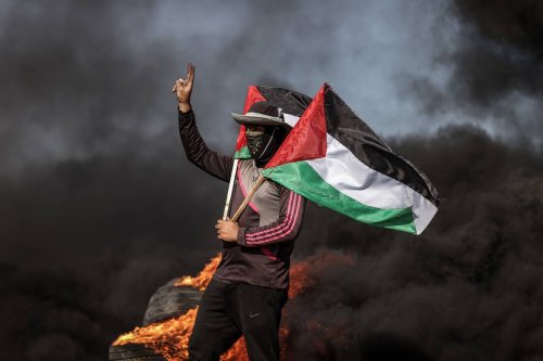Palestinians burn car tires to protest the violence of Israel in Jenin after at least 9 died and 50 injured, in Gaza City, Gaza on July 03, 2023 [Ali Jadallah/Anadolu Agency]