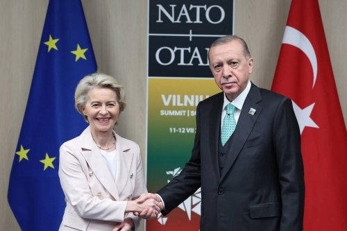 Turkish President Recep Tayyip Erdogan (R) shakes hands with President of European Commission Ursula von der Leyen (L) within the second session of the North Atlantic Treaty Organization (NATO) Heads of State and Government Summit in Vilnius, Lithuania on July 12, 2023. [TUR Presidency/Murat Cetinmuhurdar - Anadolu Agency]