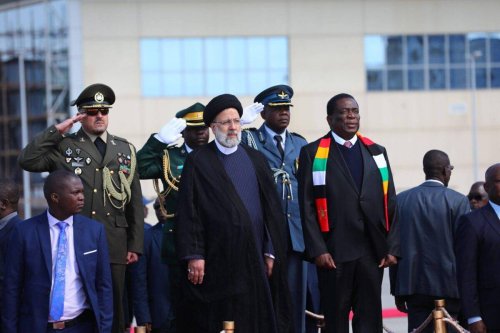 Iranian President Ebrahim Raisi (L) is welcomed with an official ceremony by President of Zimbabwe Emmerson Mnangagwa (R) in Harare, Zimbabwe on July 13, 2023 [Iranian Presidency - Anadolu Agency]
