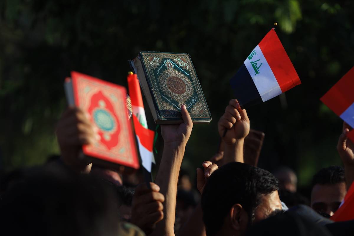People gather to protest against burning of Quran in Denmark on July 22, 2023 in Baghdad, Iraq [Murtadha Al-Sudani - Anadolu Agency]