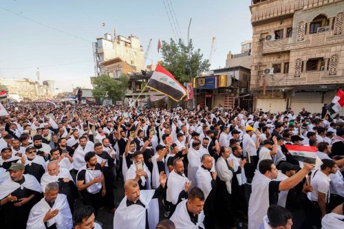 Supporters of Sadrist Movement gather with the call of the Sadrist Movement leader Muqtada al-Sadr to protest against Quran burning in Sweden and Denmark on the road between the tombs of Imam Hussain (Husayn Ibn Ali) and Abbas ibn Ali in Karbala, Iraq on July 28, 2023 [Karar Essa - Anadolu Agency]