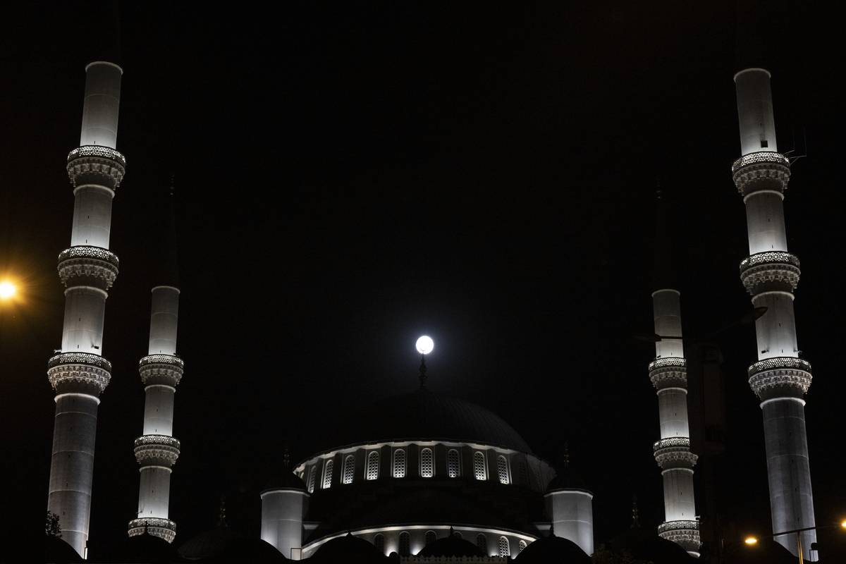 Full moon rises over Kocatepe Mosque in Ankara, Turkiye on July 31, 2023 [Harun Özalp - Anadolu Agency]
