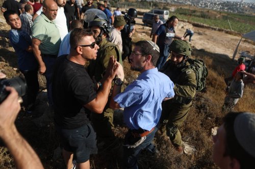 Israeli forces intervene to Palestinians who staged a demonstration against land confiscation of Jewish settlers in Hebron, West Bank on August 01, 2023. [Mamoun Wazwaz - Anadolu Agency]