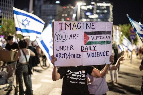 Israeli protesters march 'for judicial independence' at the Kaplan street, after the coalition government led by Prime Minister Benjamin Netanyahu passed the controversial 'judicial reform' law in parliament in Tel Aviv, Israel on August 5, 2023 [Mostafa Alkharouf - Anadolu Agency]