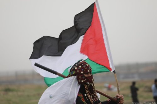 Palestinians seen at the anniversary march of the "Great March of Return" and "Palestinian Land Day" protests at Israel-Gaza border on March 30, 2019 [Mohammad Asad / Middle East Monitor]