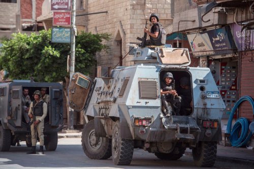 Egyptian policemen stand guard in the streets of North Sinai on 26 July 2018 [KHALED DESOUKI/AFP/Getty Images]
