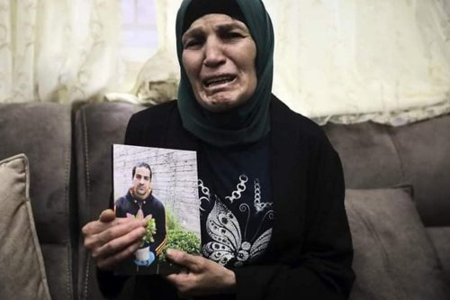 The mother of Eyad Hallaq, an autistic Palestinian man who was killed by Israeli forces in Jerusalem on 30 May 2020 [Twitter]