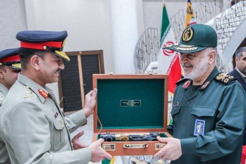 The Chief of Army Staff of the Pakistan Army, General Asim Munir, gifts a Pakistan Ordnance Factory gold-plated submachine gun, to Major General Hossein Salami, commander-in-chief of the Islamic Revolutionary Guard Corps (IRGC), on 17 July 2023 [DEFA Press]