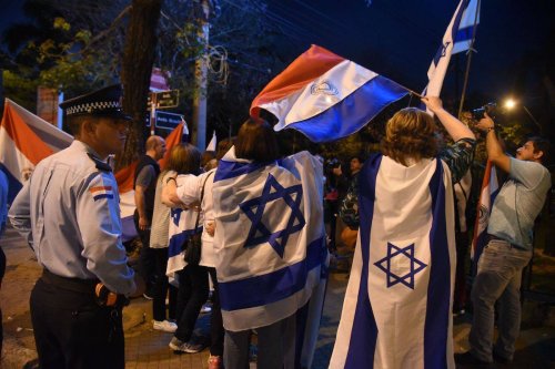 People demonstrate outside the presidential residence in Asuncion on September 06, 2018 against the government's decision of moving its embassy in Israel back to Tel Aviv. [NORBERTO DUARTE/AFP via Getty Images]