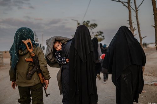 Veiled women, reportedly wives and members of Daesh, at al-Hol camp in northeastern Syria on February 17, 2019 [BULENT KILIC/AFP via Getty Images]
