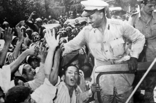 Free officers leaders including Anwar Sadat are mobbed by crowds during the 1952 Egyptian Revolution [Universal History Archive/Universal Images Group via Getty Images]