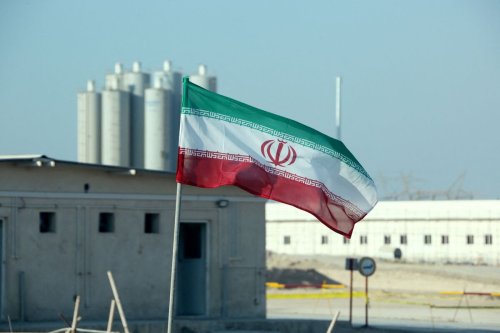 Iranian flag in Iran's Bushehr nuclear power plant. on November 10, 2019, [Photo by ATTA KENARE/AFP via Getty Images]