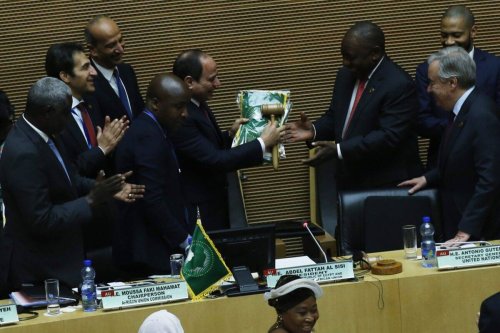 South African President Cyril Ramaphosa (3rd R) assumes gavel for a year-long African Union (AU) presidency from the outgoing Abdel-Fattah El-Sisi (5th L) during the 33rd African Union Heads of State Summit in Addis Ababa, Ethiopia on February 09, 2020 [Minasse Wondimu Hailu/Anadolu Agency via Getty Images]