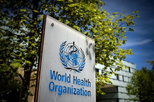 A sign of the World Health Organisation (WHO) [FABRICE COFFRINI/AFP via Getty Images]