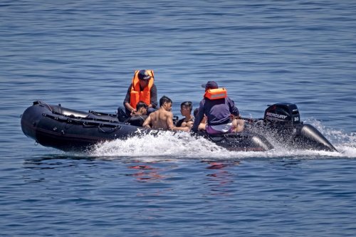 Royal Moroccan Navy officers intercept migrants in the water at the border between Morocco and the Spanish enclave of Ceuta on May 19, 2021 in Fnideq [FADEL SENNA/AFP via Getty Images]