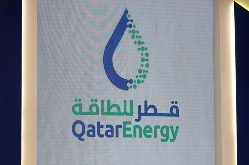 The new brand name and logo of Qatar Energy is revealed during a press conference in Doha on October 11, 2021 [KARIM JAAFAR/AFP via Getty Images]