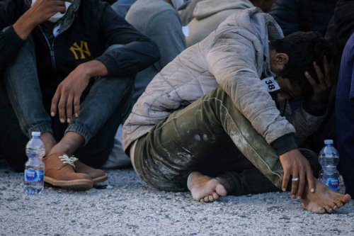 Migrants seen at the harbor of Roccella Jonica [Valeria Ferraro/SOPA Images/LightRocket via Getty Images]