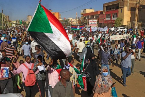 Sudanese protesters gather in the busy Jabra district of southern Khartoum on November 25, 2021 [ASHRAF SHAZLY/AFP via Getty Images]