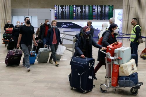 Israeli passengers arrive from Ukraine via the border with Romania on an Israeli 'Israir' rescue flight at Israel's Ben Gurion airport in Lod, near Tel Aviv, on March 1, 2022 [JACK GUEZ/AFP via Getty Images]