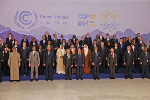 Leaders and participants pose for a family photo during the 2022 United Nations Climate Change Conference, more commonly known as COP27, at the Sharm El Sheikh International Convention Centre, in Egypt's Red Sea resort of Sharm El Sheikh, Egypt. [Photo by AHMAD GHARABLI/AFP via Getty Images]