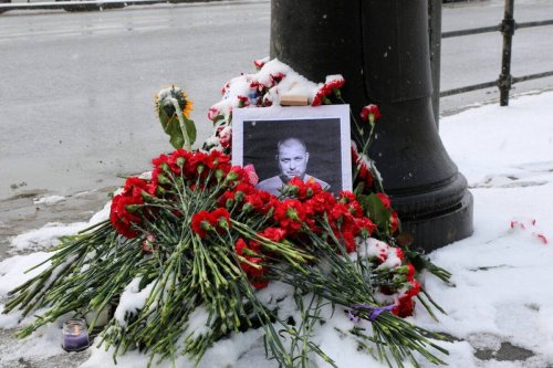 A portrait of Russian military blogger Vladlen Tatarsky, whose real name is Maxim Fomin, who was killed in the April 2 bomb blast in a cafe, is seen among flowers at a makeshift memorial by the explosion site in Saint Petersburg, Russia on 3 April 2023 [Maksim Konstantinov/SOPA Images/LightRocket via Getty Images]