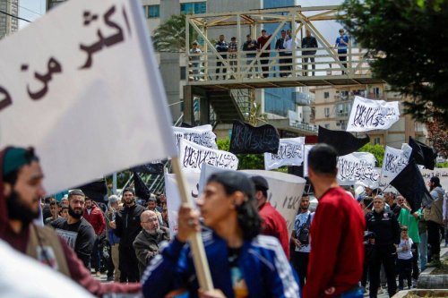 People protest in the northern Lebanese port city of Tripoli, on April 28, 2023, against the deportation of Syrian refugees [Ibrahim Chalhoub / AFP) (Photo by IBRAHIM CHALHOUB/AFP via Getty Images]