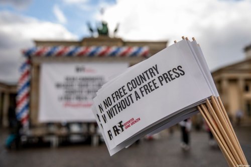 Supporters of Reporters Without Borders (RSF) protest in front of the The Brandenburg Gate to demand both U.S. presidential candidates state publicly to guarantee freedom of the press in the U.S [Maja Hitij/Getty Images]